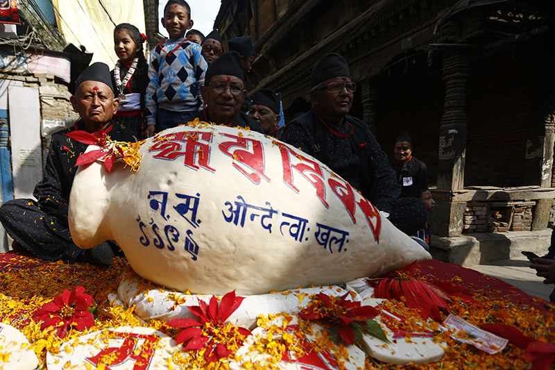 A 'yomari' is displayed during a parade to celebrate Yomari Punhi festival that marks the end of rice harvest season, in Kathmandu, on Saturday, December 22, 2018. Photo: Skanda Gautam/THT