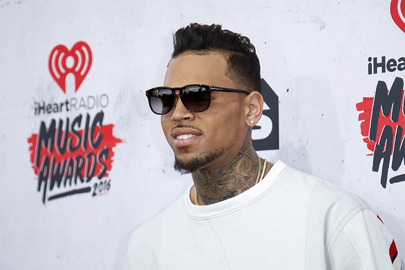 FILE PHOTO: Recording artist Chris Brown poses at the 2016 iHeartRadio Music Awards in Inglewood, California, April 3, 2016. Photo: Reuters
