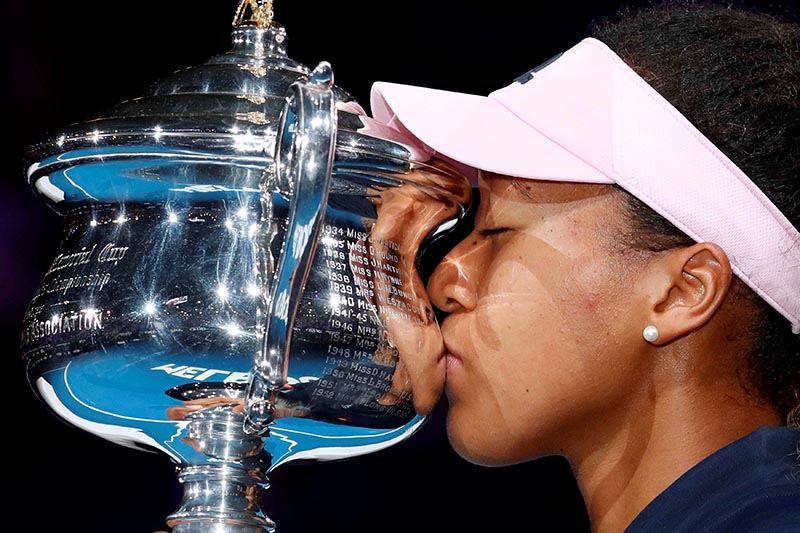 Japan's Naomi Osaka kisses her trophy after winning her Australian Open Women's Singles Final  match against Czech Republic's Petra Kvitova, at Melbourne Park, in Melbourne, Australia, on January 26, 2019. Photo: Reuters