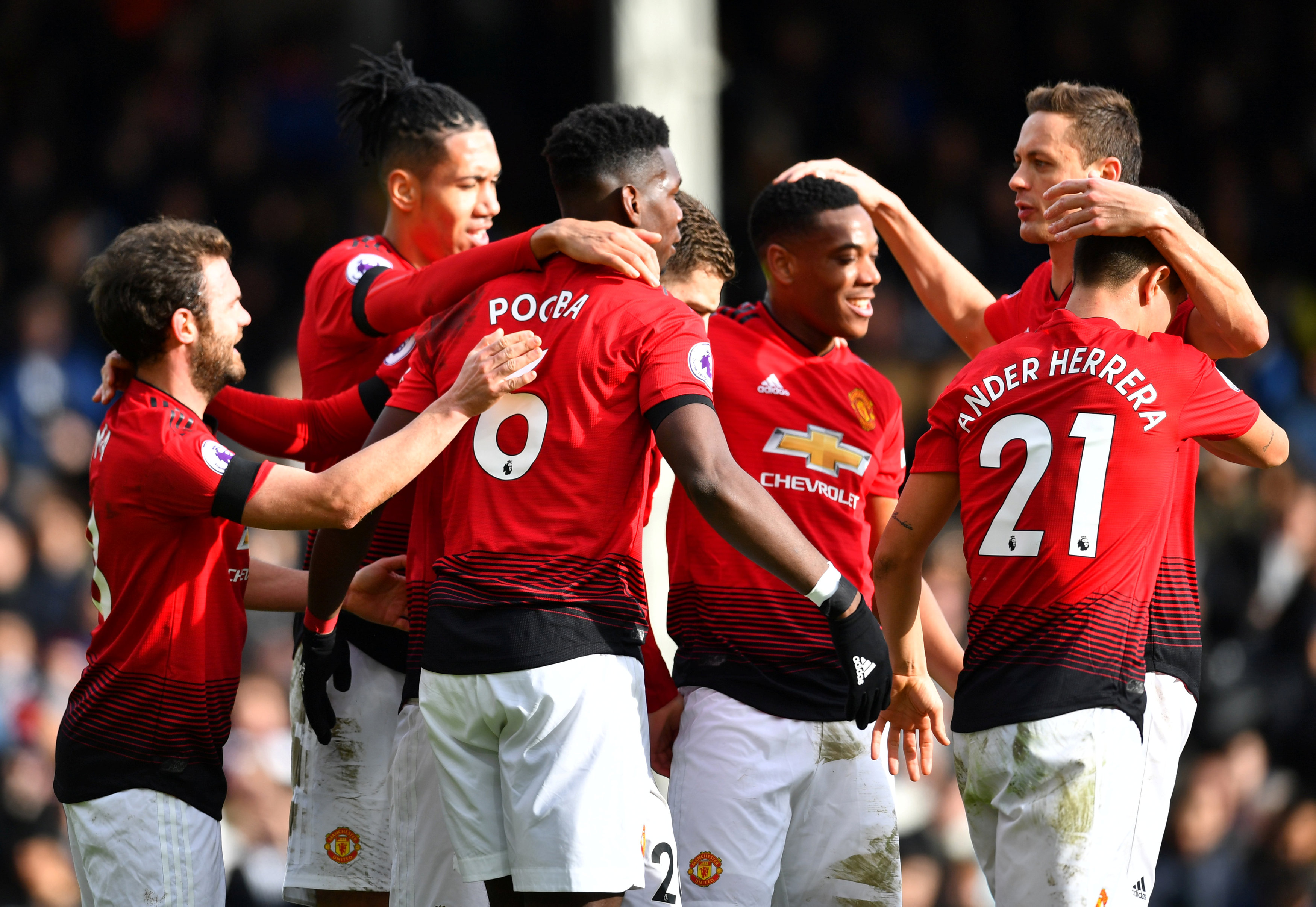 Soccer Football - Premier League - Fulham v Manchester United - Craven Cottage, London, Britain - Febraury 9, 2019  Manchester United's Paul Pogba celebrates scoring their third goal with Juan Mata and team mates.  REUTERS