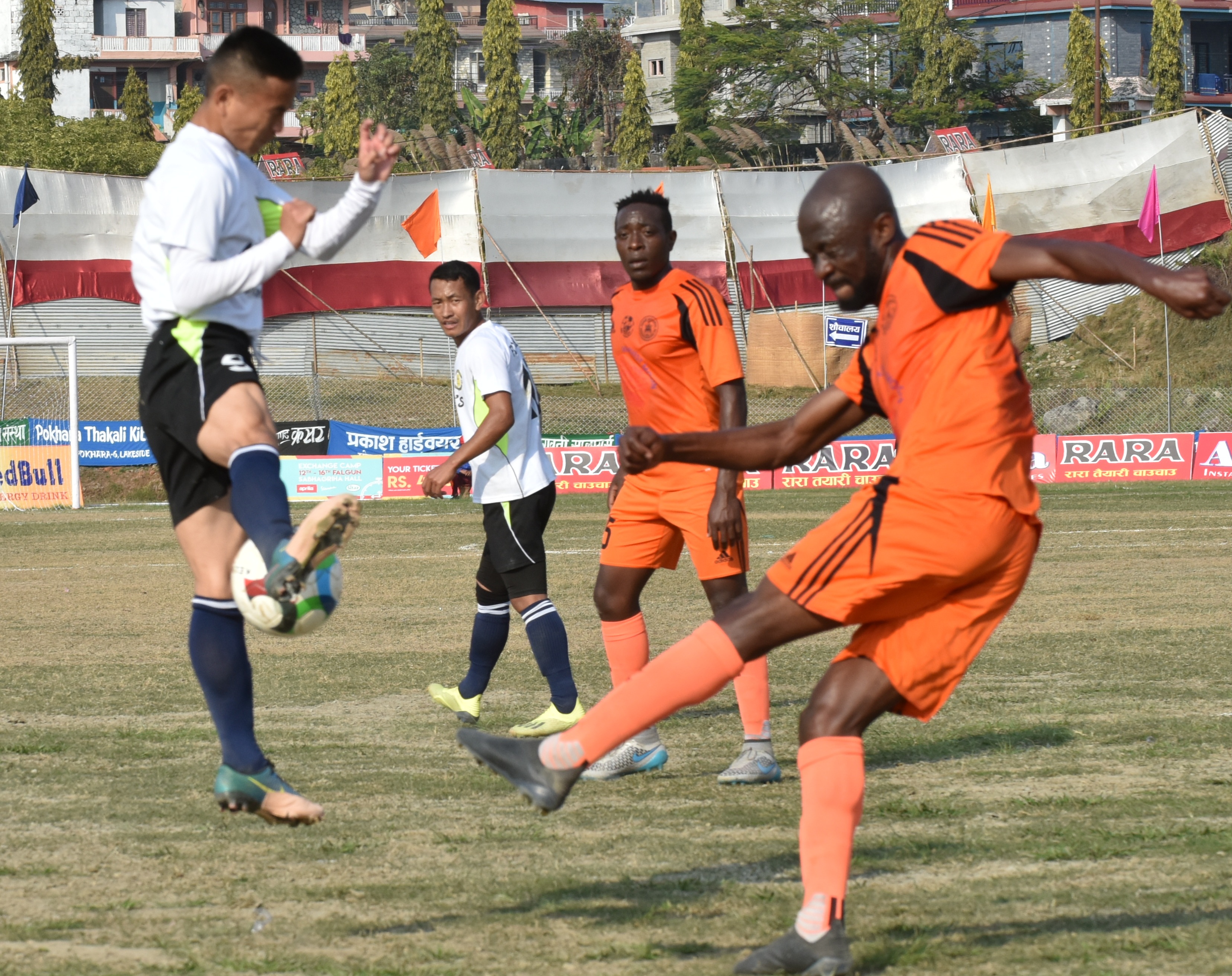 Action in the match between Dharan Football Club (left) and Himalayan Sherpa Club during their 17th Aaha Rara Gold Cup match in Pokhara on Friday. Photo: THT