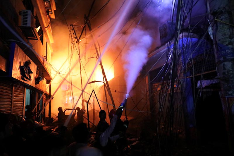 Firefighters work at the scene of a fire that broke out at a chemical warehouse in Dhaka, Bangladesh on Thursday, February 21, 2019. Photo: Reuters