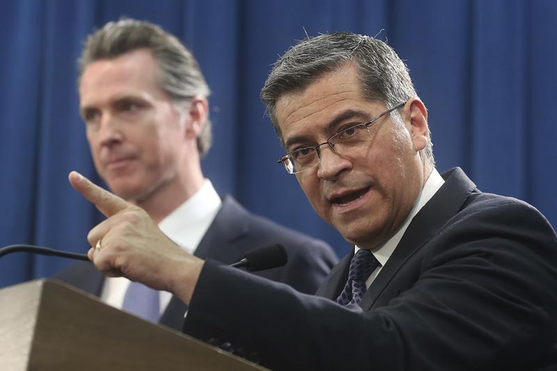 FILE - In this February 15, 2019, file photo, California Attorney General Xavier Becerra (right) accompanied by Governor Gavin Newsom, said California was probably suing President Donald Trump over his emergency declaration to fund a wall on the US-Mexico border in Sacramento, California. Becerra filed a lawsuit Monday, February 18, against Trump's emergency declaration to fund a wall on the US-Mexico border. Photo: AP