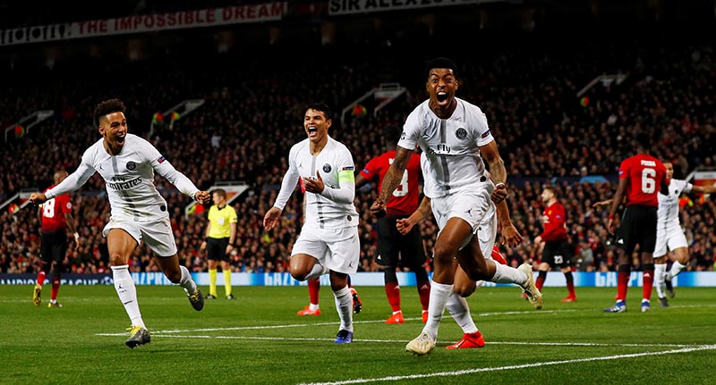 Paris St Germain's Presnel Kimpembe celebrates scoring their first goal with Thiago Silva and Thilo Kehrer during the Champions League Round of 16 First Leg match between Manchester United and Paris St Germain, at Old Trafford, in Manchester, Britain, on February 12, 2019. Photo: Action Images via Reuters