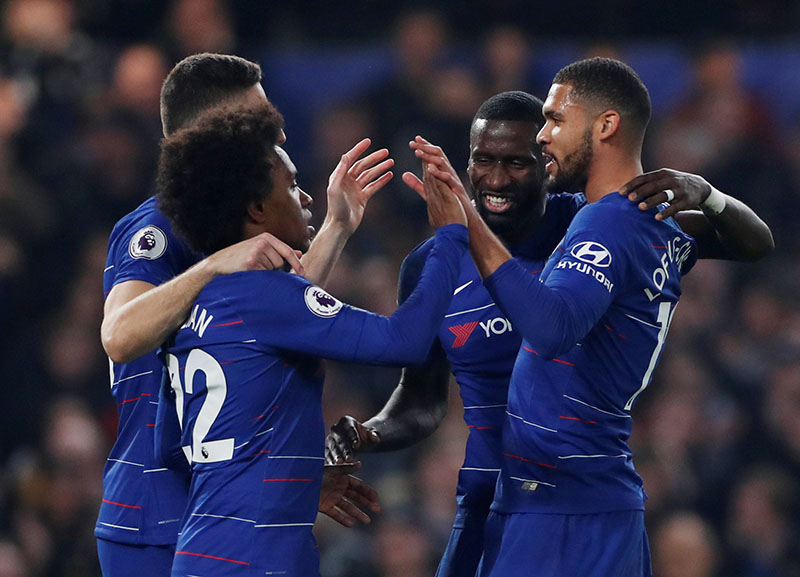 Chelsea's Willian, Antonio Rudiger and Ruben Loftus-Cheek celebrate after Tottenham's Kieran Trippier scored an own goal and Chelsea's second during the Premier League match between Chelsea and Tottenham Hotspur, at  Stamford Bridge, in London, Britain, at February 27, 2019. Photo: Action Images via Reuters