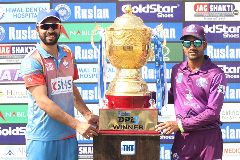 Sharad Vesawakar (left) and Dipendra Singh Airee respectively skippers of Mahendranagar United and CYC Attariya take photo with winneru2019s trophy during pre-final match press meet of Rusland Dhangadhi Premier League at Fapla International Cricket Stadium in Dhangadhi on Friday. Photo: Udipt Singh Chhetry