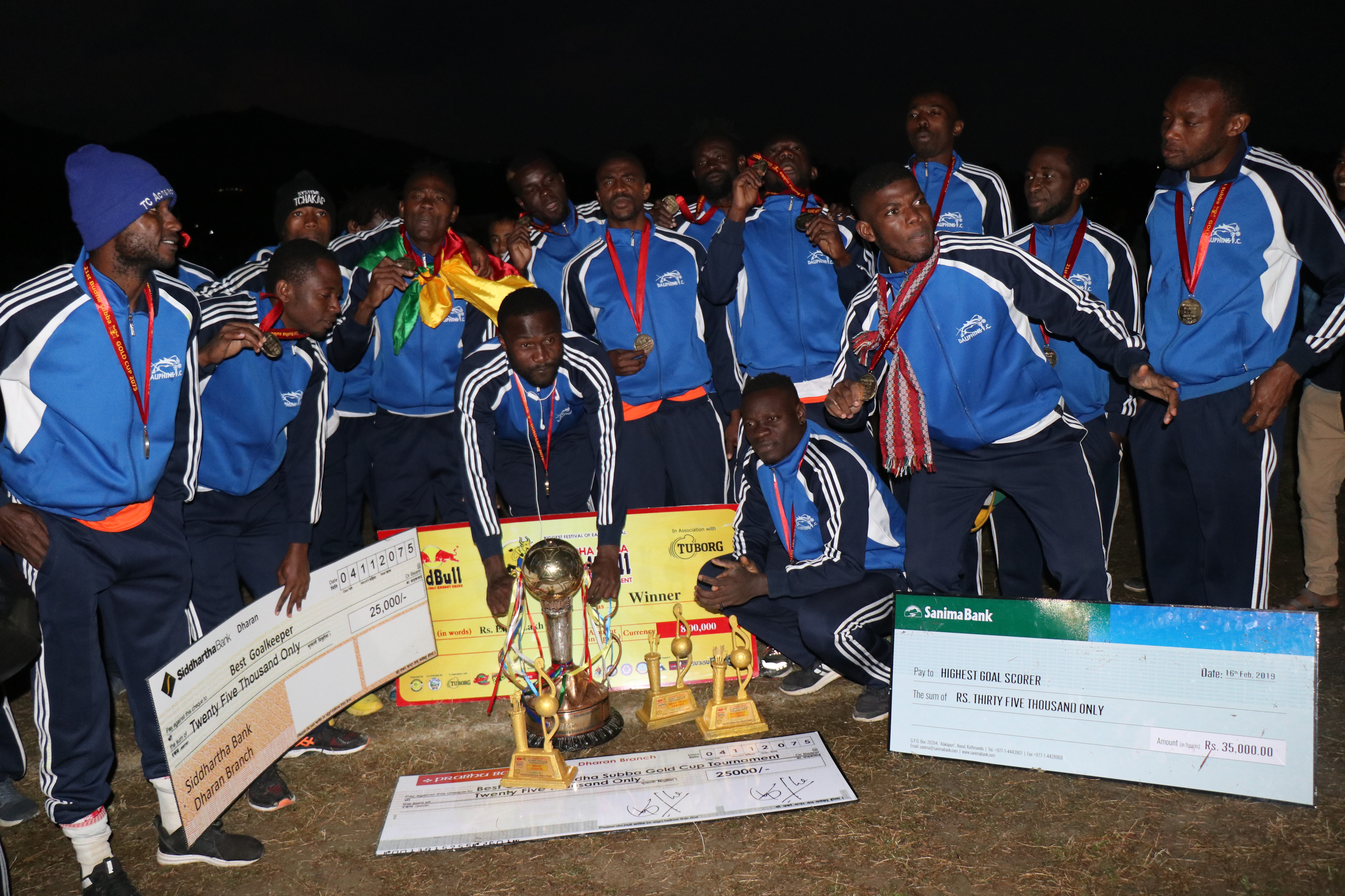 Team members of Dauphins Family Club pose for the group photo after winning the title of the 21st Budha Subba Red Bull Gold Cup in Sunsari on Saturday, February 16, 2019. Photo: THT