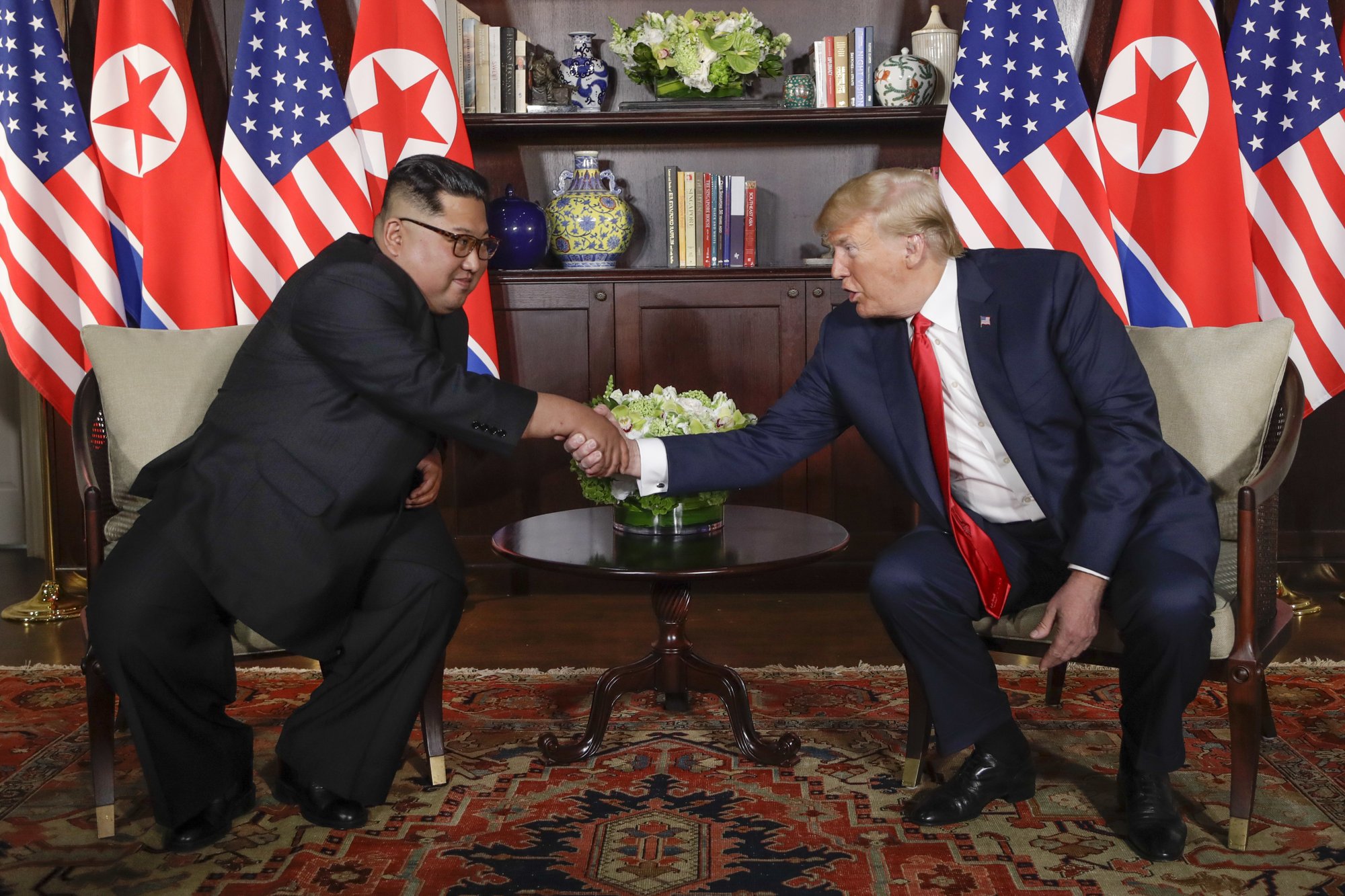 FILE - In this June 12, 2018, file photo, North Korea leader Kim Jong Un, left, and U.S. President Donald Trump shake hands during their first meeting at the Capella resort on Sentosa Island in Singapore. Photo: AP