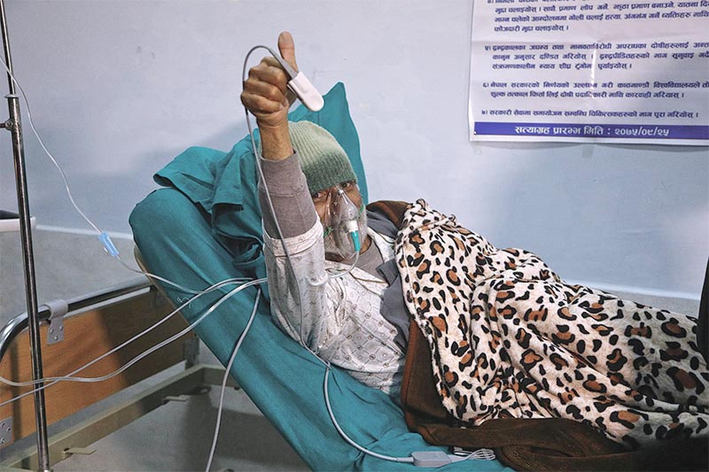 Senior orthopaedic surgeon Dr Govinda KC giving a thumbs-up sign after ending his fast-unto-death after n24 days at TU Teaching Hospital, in Kathmandu, on Friday, February 1, 2019. Photo: Skanda Gautam/THT