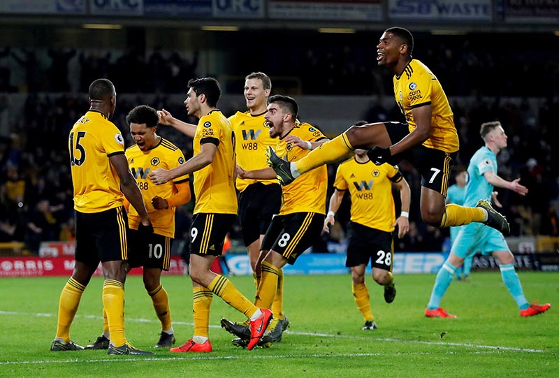 Wolverhampton Wanderers' Willy Boly celebrates scoring their first goal with team mates and Ivan Cavaleiro  during the Premier League match between Wolverhampton Wanderers and Newcastle United, at Molineux Stadium, in Wolverhampton, Britain, on February 11, 2019. Photo: Action Images via Reuters