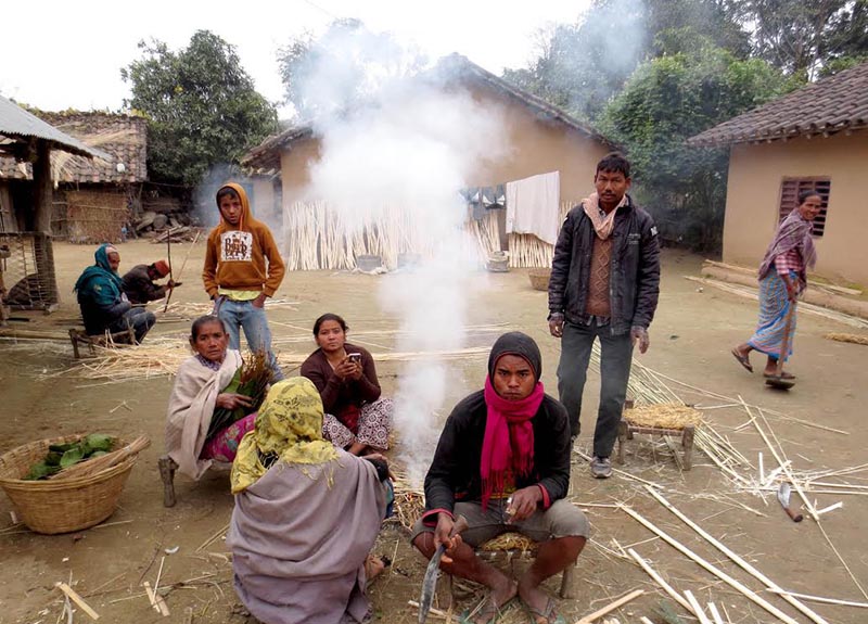 Locals warming themselves around a fire following a cold wave in Dhangadi sub-metropolis, Kailali, on Sunday, February 10, 2019. Photo: THT