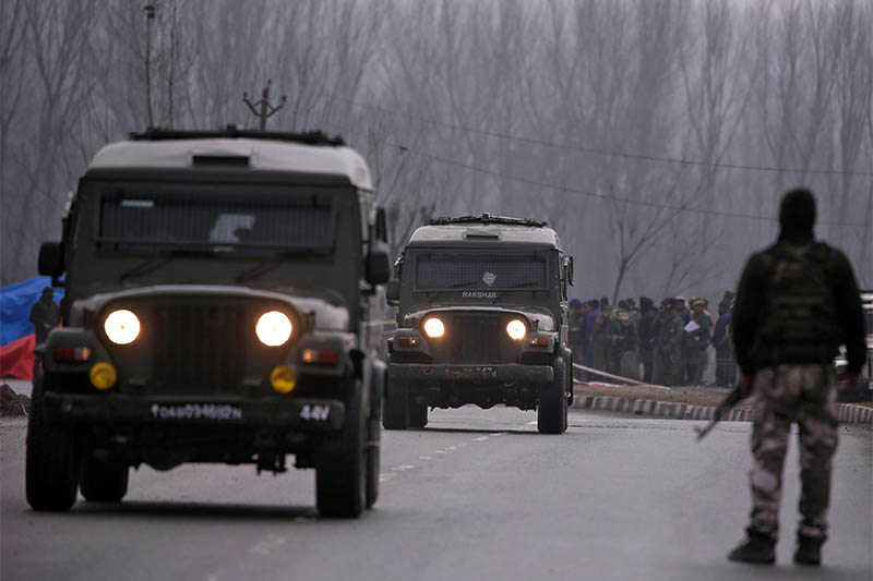 FILE PHOTO: Indian soldiers stand guard near the site of Thursday's suicide bomb attack in Lethpora in south Kashmir's Pulwama district February 15, 2019. Photo: Reuters