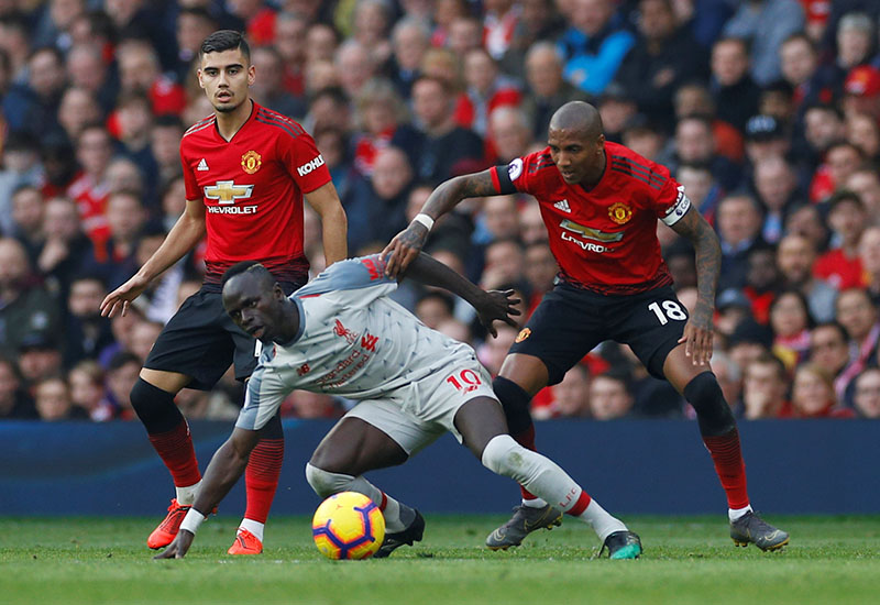 Liverpool's Sadio Mane in action with Manchester United's Ashley Young and Andreas Pereira during the Premier League match between Manchester United and Liverpool, at Old Trafford, in Manchester, Britain, at February 24, 2019. Photo: Reuters