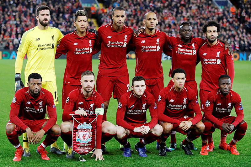 Liverpool players pose for a team group photo before the match. Photo: Reuters