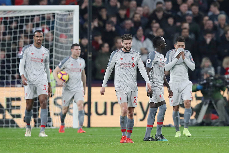 Liverpool's Adam Lallana, James Milner and team mates react after conceding their first goal scored by West Ham's Michail Antonio. Photo: Reuters
