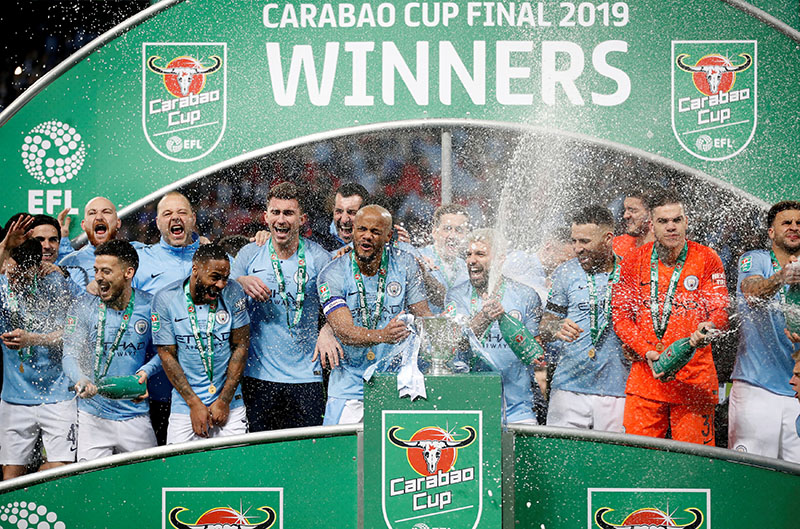 Manchester City's Vincent Kompany and team mates celebrate with the trophy after the match during the Carabao Cup Final match between Manchester City and Chelsea, at Wembley Stadium, in London, Britain, on February 24, 2019. Photo: Action Images via Reuters