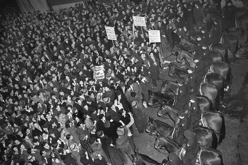 This February 20, 1939 photo shows New York City's mounted police forming a line outside Madison Square Garden to hold in check a crowd that packed the streets where the German American Bund was holding a rally. Photo: AP/File