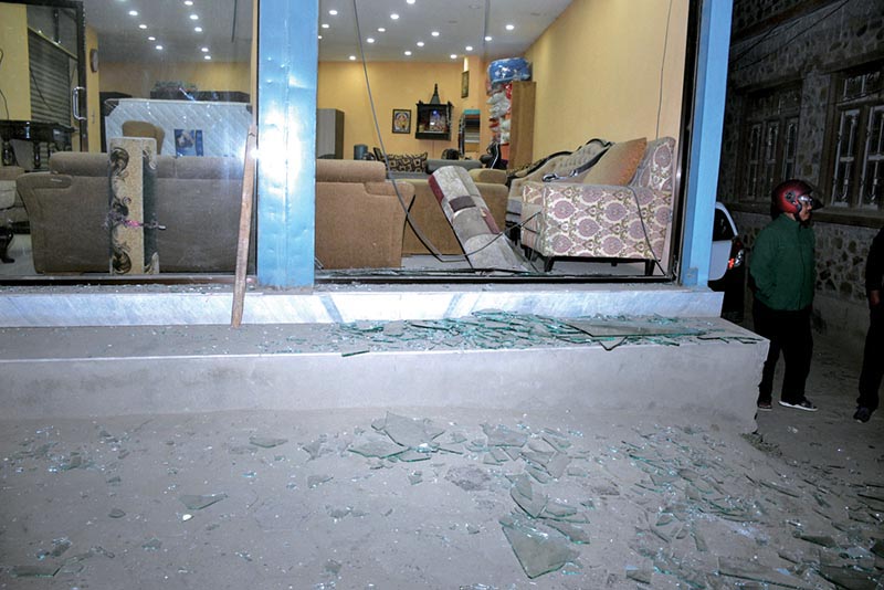 Shattered glass panes are seen outside a furniture shop beside the Ncell office, in Nakkhu, Lalitpur, on Friday, February 22, 2019. Photo: Naresh Shrestha/THT