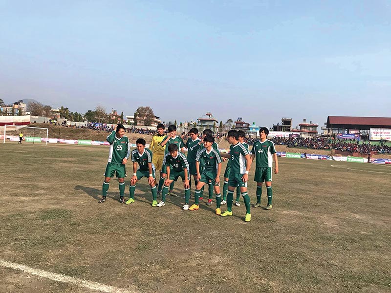 Rissho University team members assemble for a group photo before their Manakamana Cable Car Pokhara Cup match against Nepal Police Club in Pokhara on Tuesday. Photo: THT