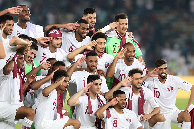 Qatar players celebrate winning the Asian Cup. Photo: Reuters