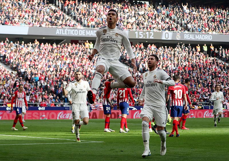 Real Madrid's Casemiro celebrates scoring their first goal with Sergio Ramos during the  La Liga Santander match between Atletico Madrid and Real Madrid, at Wanda Metropolitano, in Madrid, Spain, on February 9, 2019. Photo; Reuters