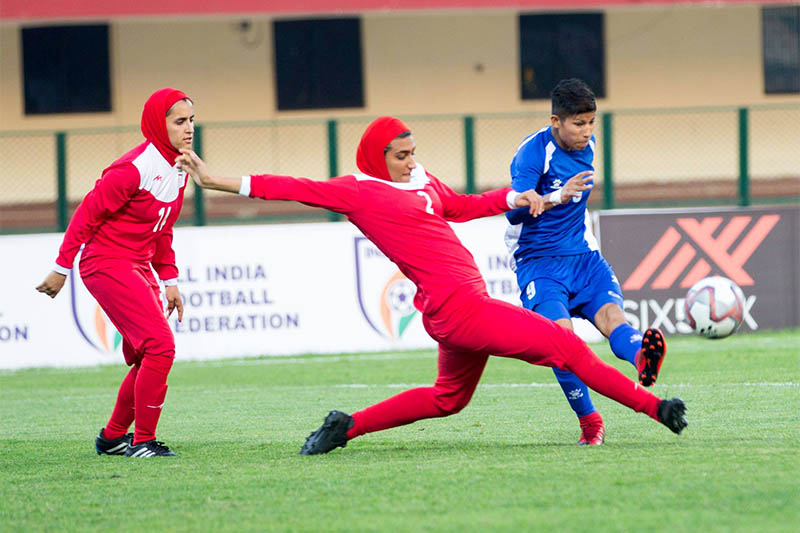 Nepali striker Sabitra Bhandari tries to shoot past Iranian player during Hero Women's Gold Cup tournament in India. Courtesy: ANFA