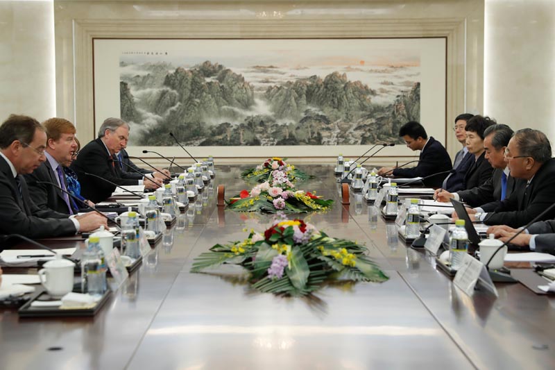 Myron Brilliant, executive vice president and head of International Affairs at the US Chamber of Commerce (2-L) and Chinese State Councilor and Foreign Minister Wang Yi (2-R) attend a meeting at the Ministry of Foreign Affairs in Beijing, China February 19, 2019. Photo: Wu Hong/Pool via Reuters