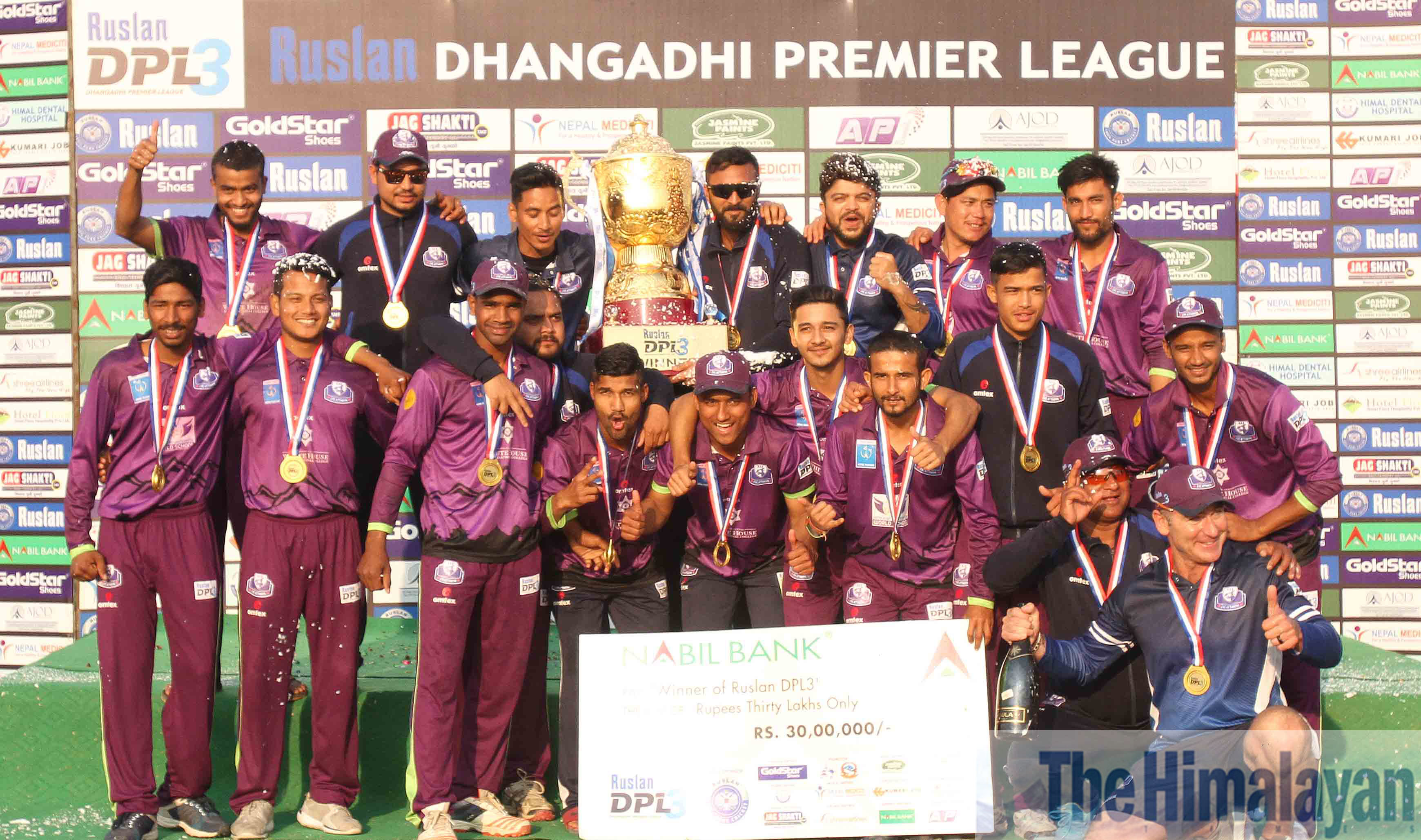 Players and officials of CYC Attariya pose with DPL winneru2019s trophy at Fapla International Cricket Stadium in Dhangadi on Saturday. Photo: Udipt Singh Chhetry/THT