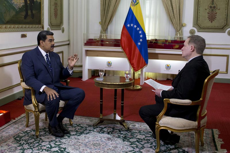 Venezuela's President Nicolas Maduro, left, speaks during an interview with Associated Press Vice President of International News, Ian Phillips, at Miraflores presidential palace in Caracas, Venezuela, Thursday, February 14, 2019.Photo: AP