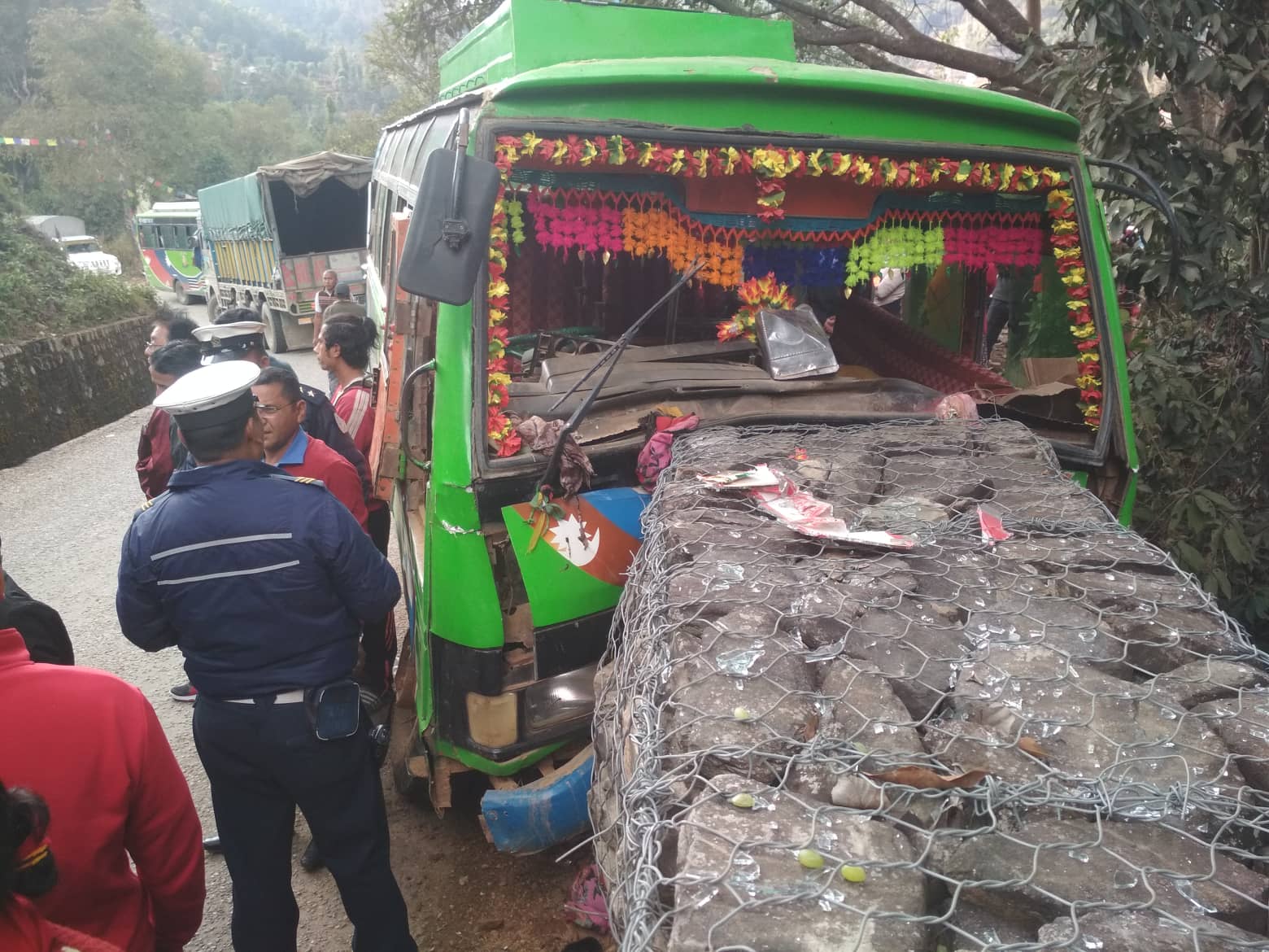 Police personnel take stock of damage at an accident site where a bus driver rammed the vehicle into a gabion fence on Saturday, February 09, 2019. Photo: Keshav Adhikari/THT