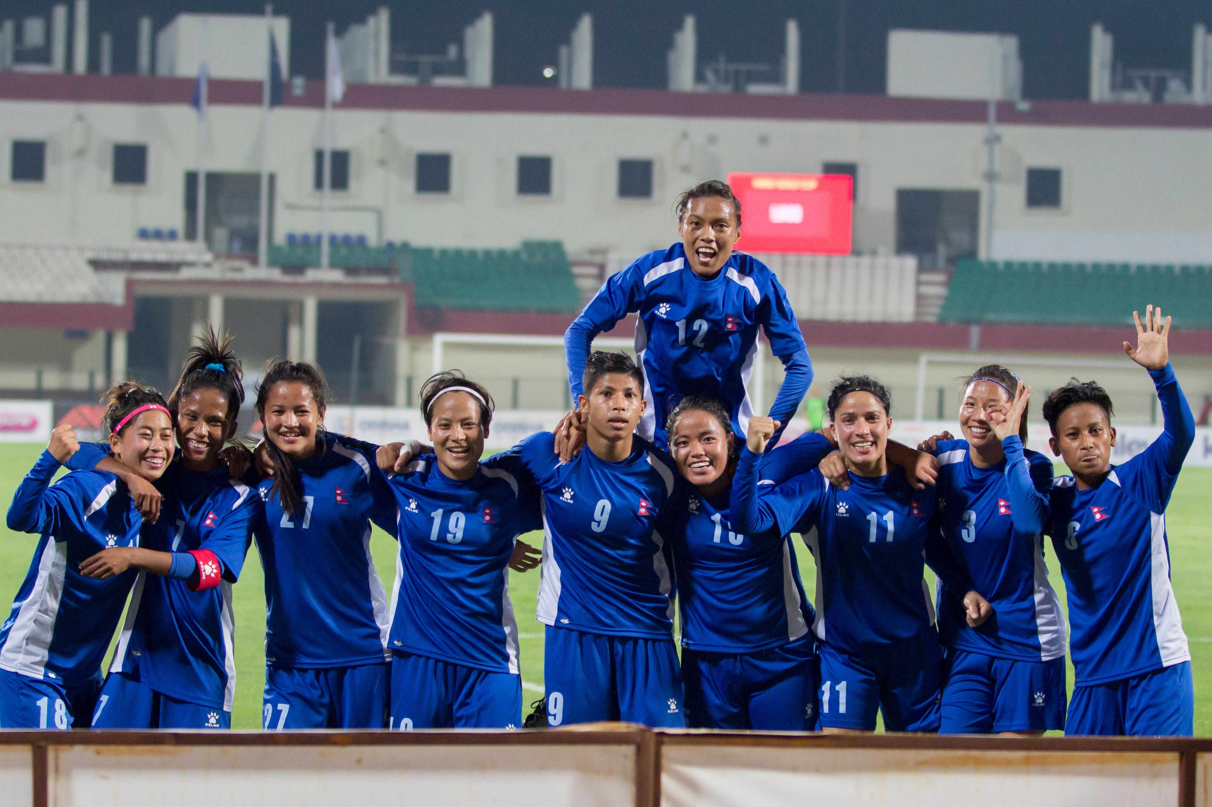 Nepal national womenu2019s football team members and officials pose for a group photo after finishing second behind Myanmar in the Hero Womenu2019s Gold Cup in Bhubaneswar, India on Friday. Photo: THT