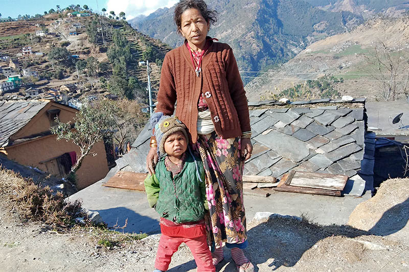 Younger sister Roshni Baduwal with her grandmother pose for a portrait in Badimalika Municipality of Bajura district, on Friday, March 01, 2019. Photo: Prakash Singh