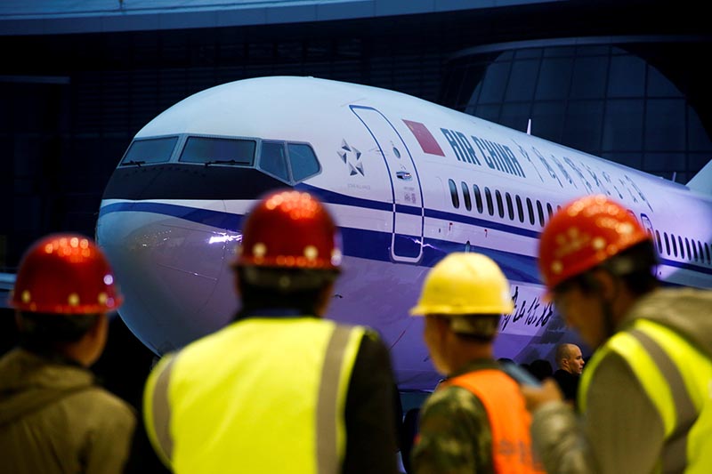 FILE: Workers attend a ceremony marking the 1st delivery of a Boeing 737 Max 8 airplane to Air China at the Boeing Zhoushan completion center in Zhoushan, Zhejiang province, China, December 15, 2018. Photo: Reuters