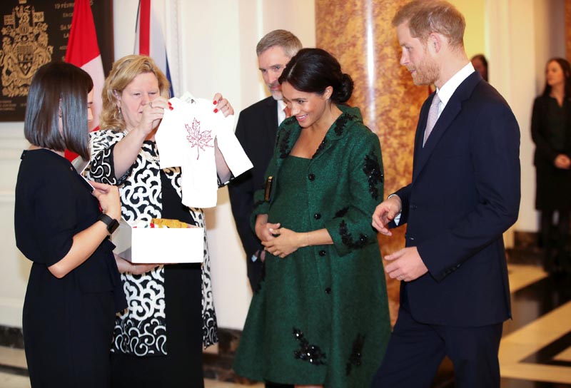 Britain's Prince Harry and Meghan, Duchess of Sussex receive baby gifts from Canadian High Commissioner to the United Kingdom Janice Charette as they attend a Commonwealth Day youth event at Canada House in London, Britain, March 11, 2019. Photo: Chris Jackson/Pool via Reuters