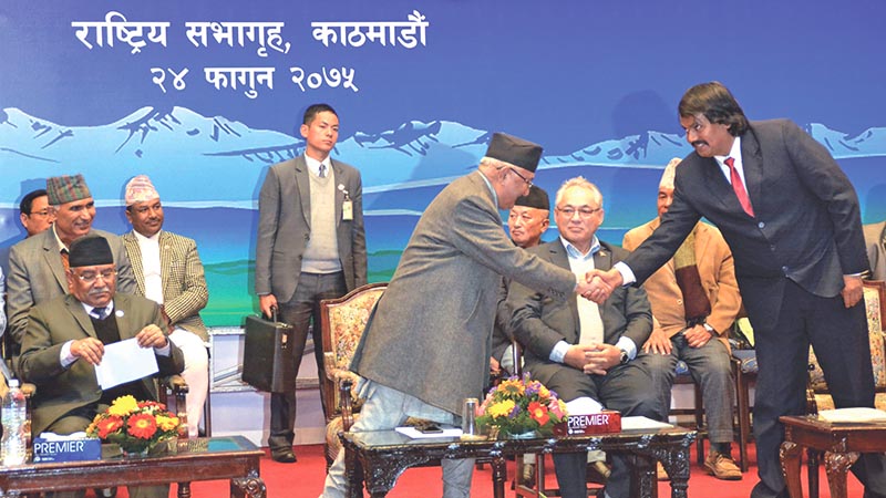 Coordinator of Alliance for Independent Madhes CK Raut (right) shaking hands with Prime Minister KP Sharma Oli after signing an 11-point pact, in Kathmandu, on Friday, March 8, 2019. Photo: THT