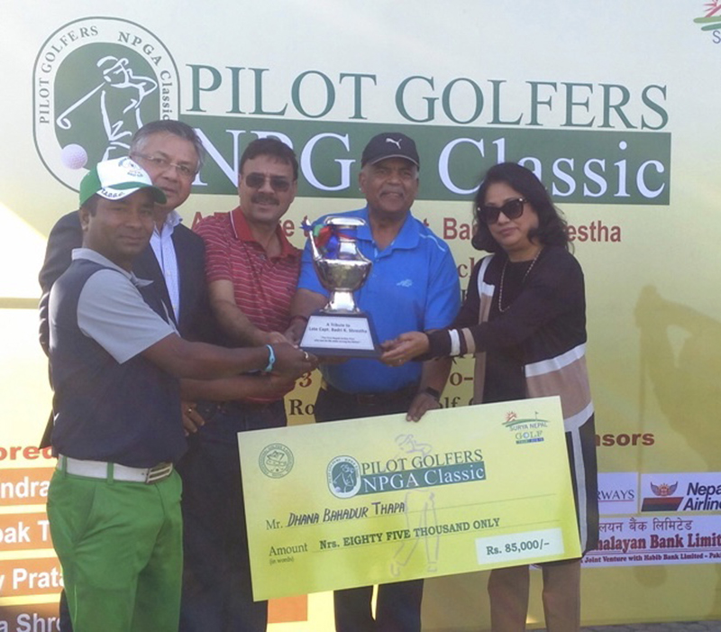 Dhana Bahadur Thapa (left) receiving the trophy after winning the Pilot Golfers NPGA Classic at the Royal Nepal Golf Club in Kathmandu on Friday, March 22, 2019. Photo: THT