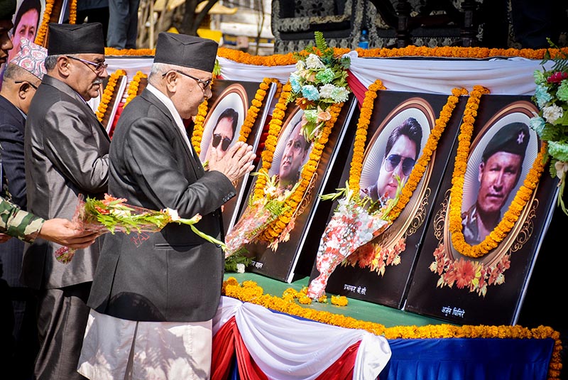 Nepal Communist Party (NCP) Co-chairpersons KP Sharma Oli and Pushpa Kamal Dahal paying homage to those killed in the Dynasty Air chopper crash, in Kathmandu, on Thursday. Photo: Naresh Krishna Shrestha/THT
