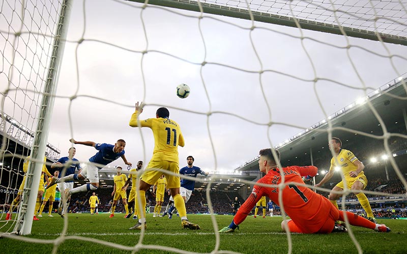 Everton's Richarlison scores their first goal during the Premier League match between Everton and Chelsea, at  Goodison Park, in Liverpool, Britain, on  March 17, 2019. Photo: Action Images via Reuters