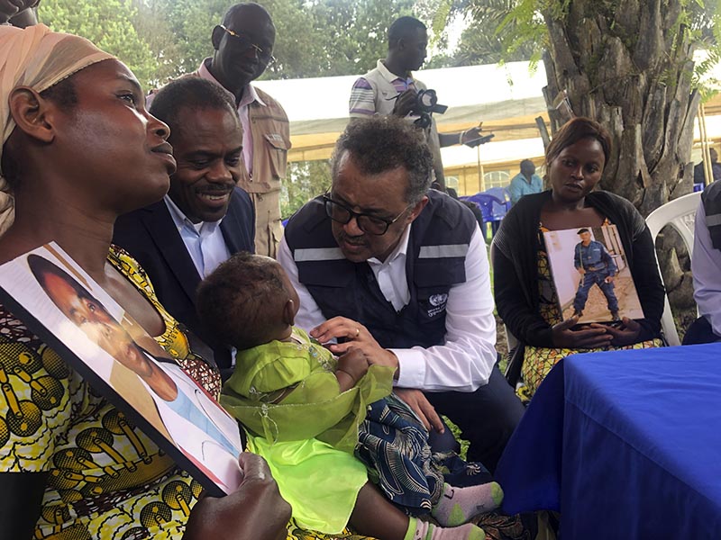 WHO Director-General, Dr Tedros Adhanom Ghebreyesus and DRC Ministry of Health, Dr Oly meet with widows who lost their husbands to conflict during a visit to an Ebola treatment centre in Butembo, in the Democratic Republic of the Congo, Saturday March 9, 2019. Photo: Dalia Lourenco/WHO via AP