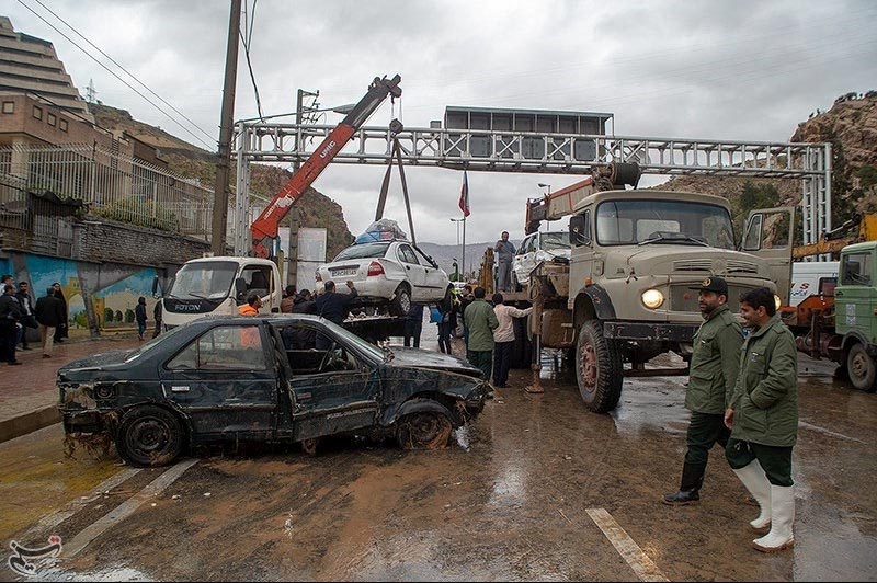 Damaged vehicles are seen after a flash flooding In Shiraz, Iran, on Monday, March 25, 2019. Tasnim News Agency via Reuters