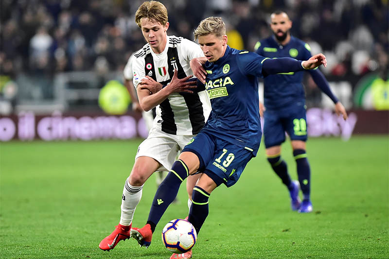 Juventus' Hans Nicolussi Caviglia in action with Udinese's Hidde ter Avest. Photo: Reuters