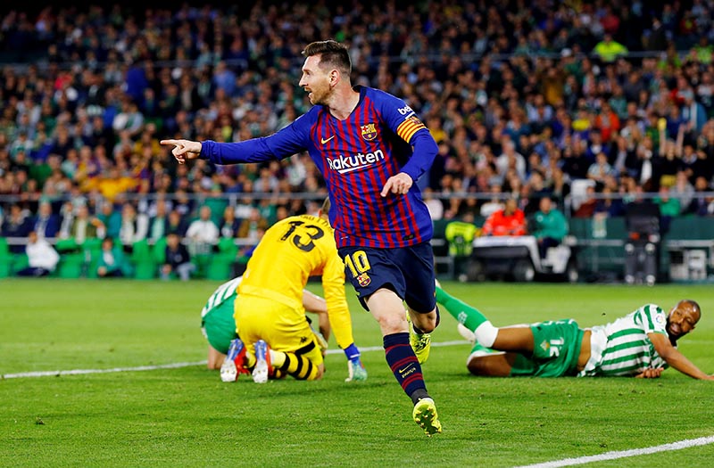 Barcelona's Lionel Messi celebrates scoring their second goal during the La Liga Santander match between Real Betis and FC Barcelona, at Estadio Benito Villamarin, in Seville, Spain, on March 17, 2019. Photo: Reuters