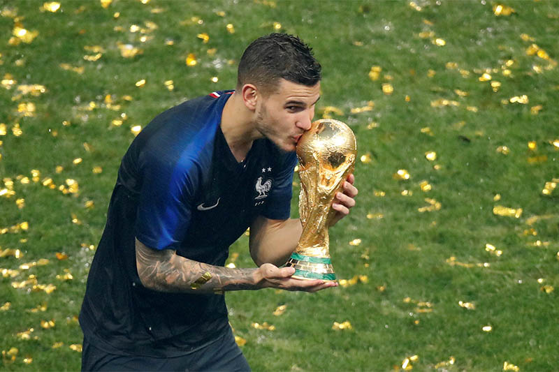 FILE: France's Lucas Hernandez kisses the trophy as they celebrate winning the World Cup. Photo: Reuters