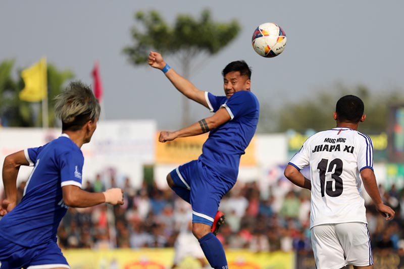 Players of Ruslan Three Star Club (left) and Jhapa-XI FC in action during the Mugmug Jhapa Gold Cup in Birtamod on Friday, March 8, 2019. Photo: THT