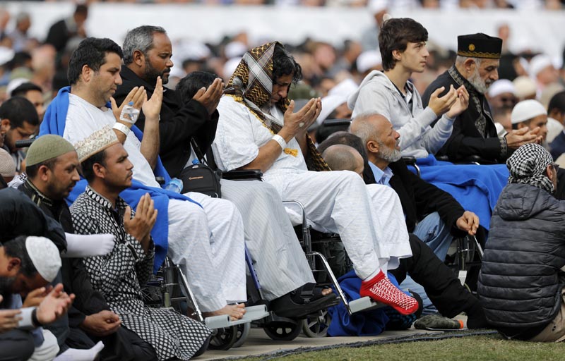 Injured victims from last week's mosque shootings pray during Friday prayers at Hagley Park in Christchurch, New Zealand, Friday, March 22, 2019. Photo: AP