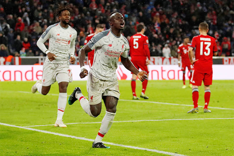 Liverpool's Sadio Mane celebrates scoring their third goal with Divock Origi. Photo: Reuters