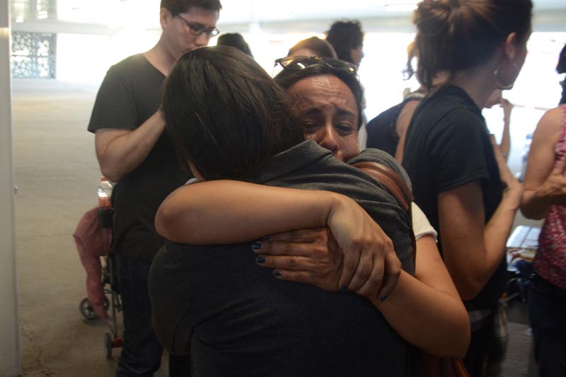 Central American migrants react as they wait to enter the US, asking for refuge and to be reunited with their children, after being separated from them by immigration authorities when crossing into the United States illegally last year, at the border crossing in Mexicali-Calexico, Mexico March 2, 2019. Photo: Reuters