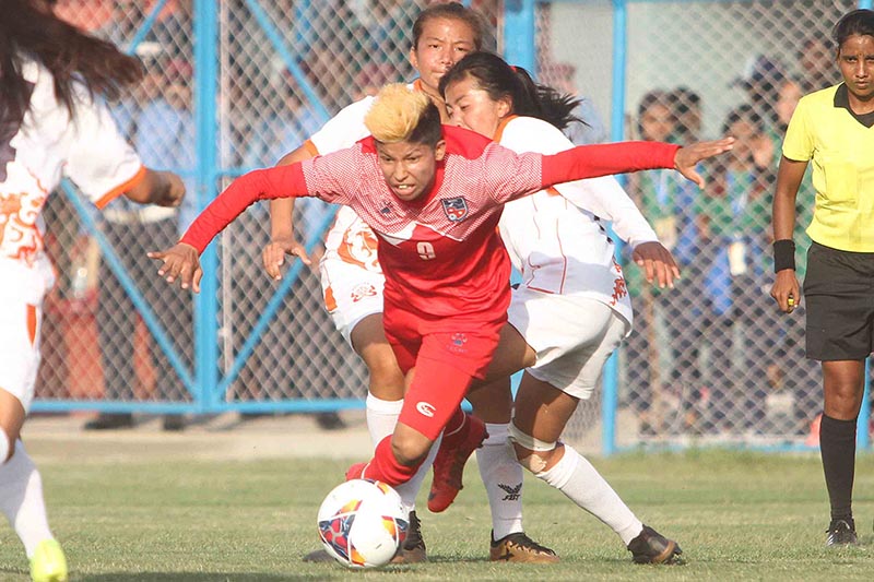 Nepal’s Sabitra Bhandari vying for the ball during a Women’s SAFF Championship match against Bhutan, in Biratnagar, on Tuesday, March 12, 2019.  Photo: Udipt Singh Chhetry/THT