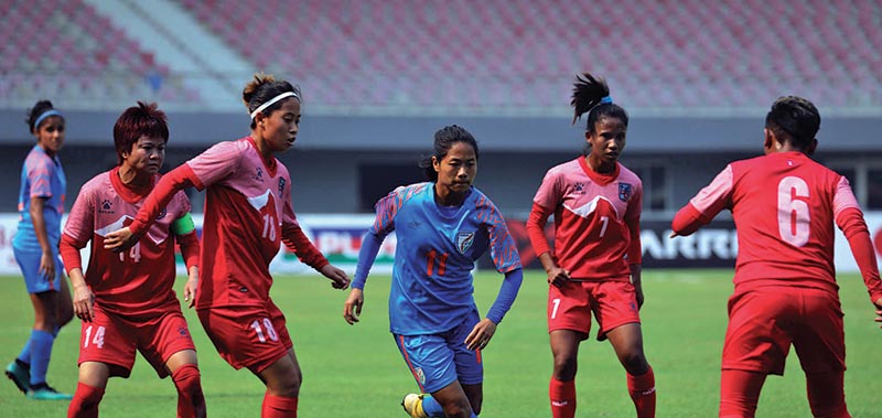 Action in the match between Nepal (centre) and India during their AFC Women’s Olympic Football Tournament Qualifiers match in Mandalay, Myanmar on Saturday. Photo Courtesy: AFC