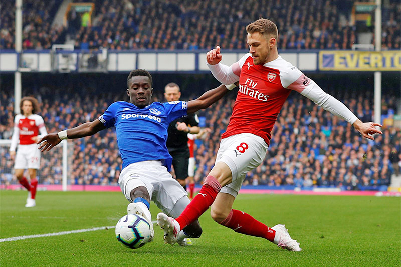 Arsenal's Aaron Ramsey in action with Everton's Idrissa Gueye. Photo: Reuters